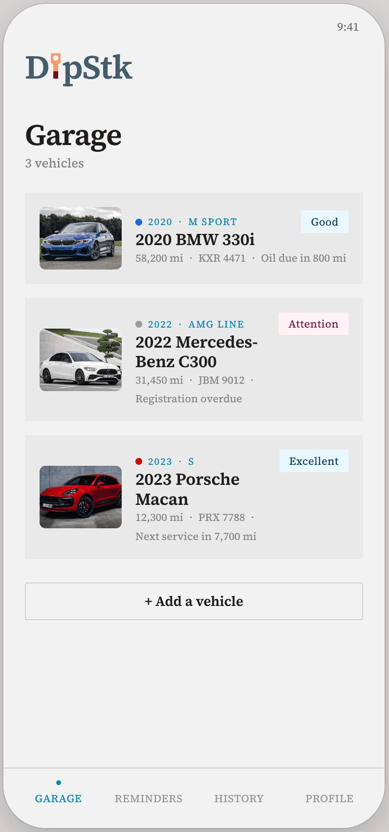 The DipStk garage screen showing three tracked vehicles, each with mileage and status at a glance